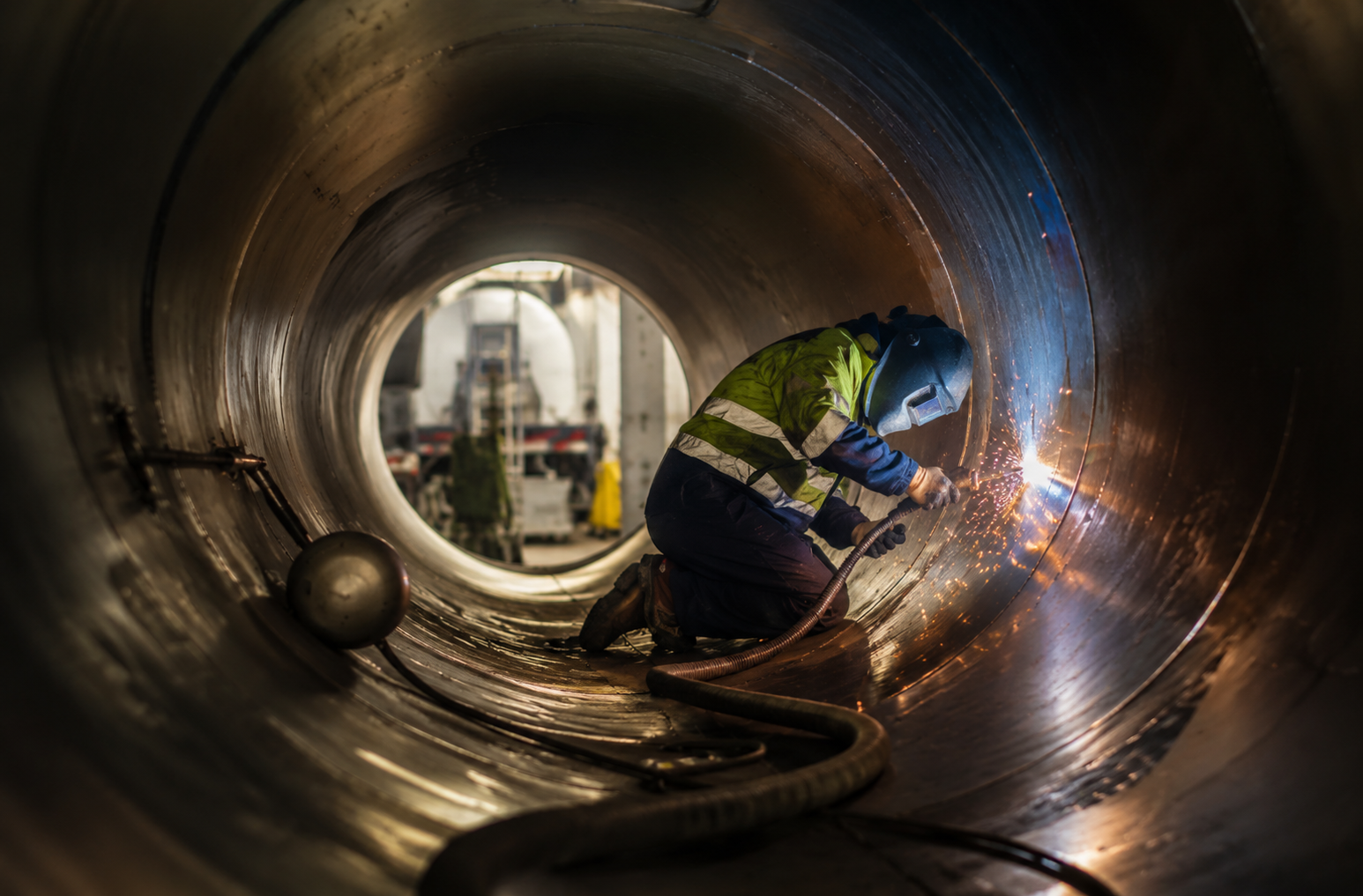 Commercial tanker repair welding inside a tanker