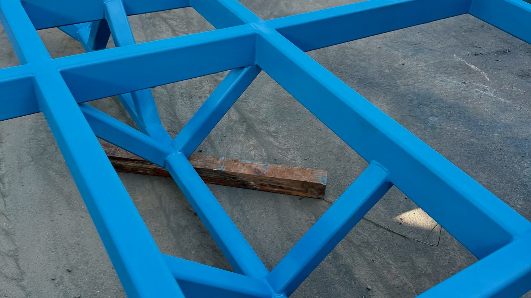 Blue custom-fabricated steel geometry