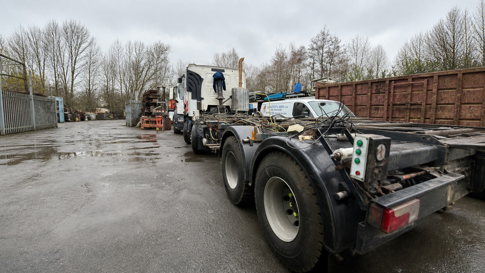 Engineer repairing a cab-over commercial vehicle in a workshop