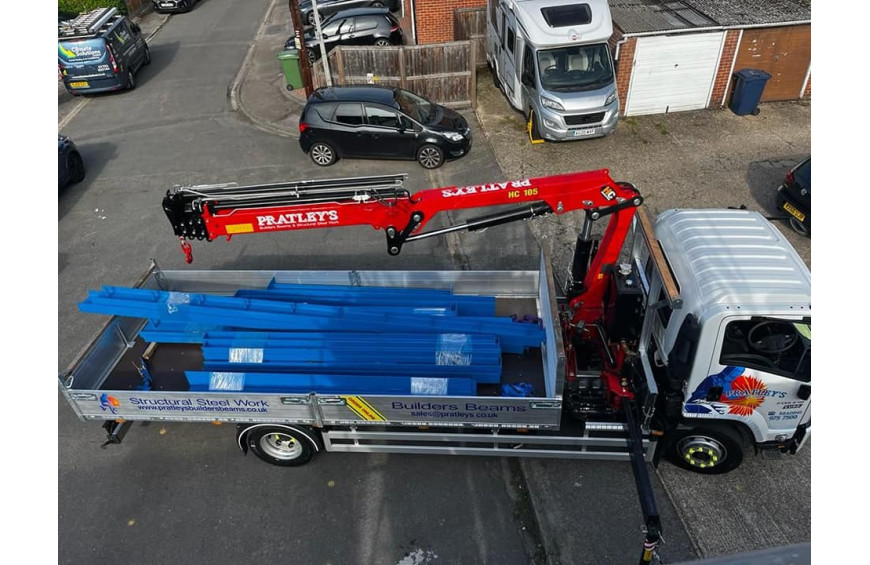 Pratleys lifting services truck carrying builders beams